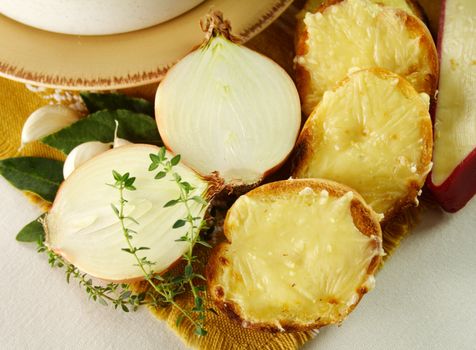 Cheese and cheddar toasted rounds with thyme and onion ready to serve.