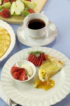 Delicious flat apple pie with strawberries and passionfruit.