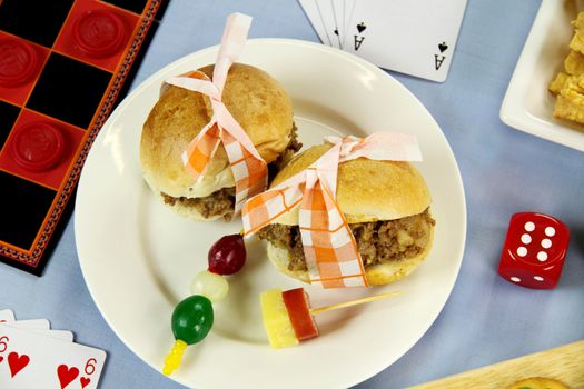 Beef burgers laid out for a night of board games.