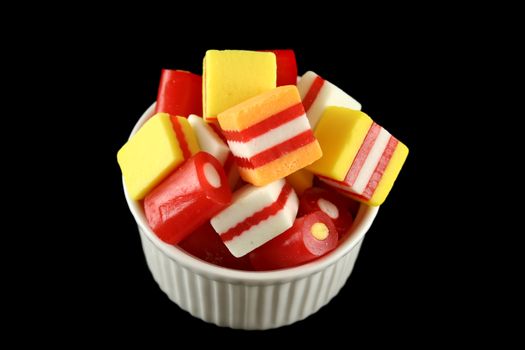 Colorful striped fruit flavored candies ready to eat.