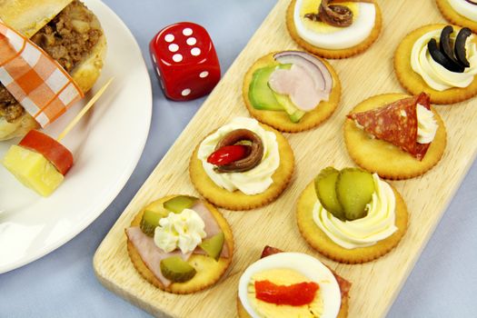 Dice and finger food laid out for a games night.