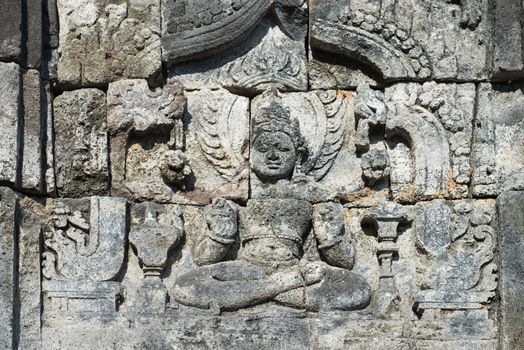 Images of Buddha on wall of temple in Candi Sewu complex (8th Century). Candi Sewu means 1000 temples, which links it to the legend of Loro Djonggrang. In fact this complex has 253 building structures and it is the second largest Buddhist temple in Java, Indonesia.