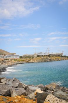 Stadium construction with blue sea on the front. Cape Town Green Point  stadium before world championship 