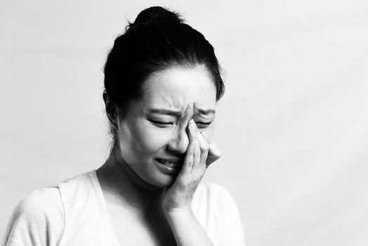 Portrait of pretty girl crying desperately, black and white style