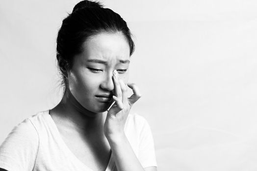 Portrait of pretty girl crying desperately, black and white style