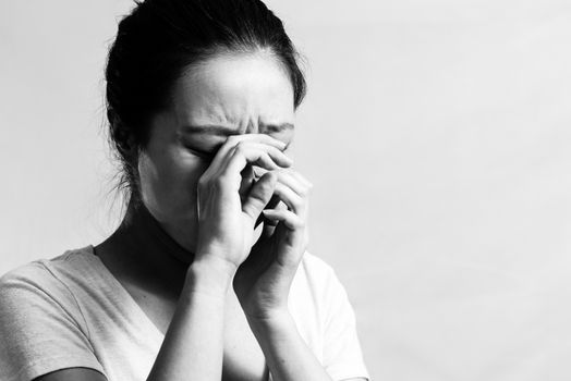 Portrait of pretty girl crying desperately, black and white style