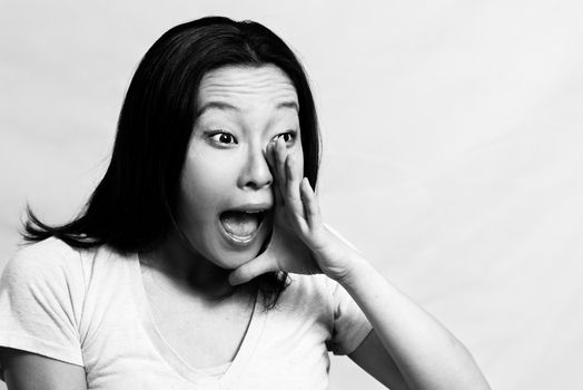 Portrait of young attractive girl yelling looking upset, black and white style