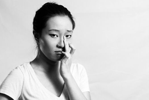 Portrait of pretty girl crying desperately, black and white style