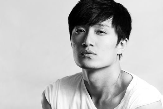 Portrait of handsome young man looking tired, black and white style