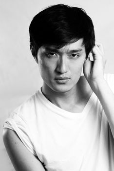 Portrait of handsome young man with cool pose, black and white style