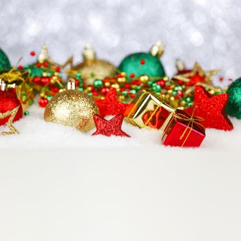 Colorful Christmas decoration and gifts on snow