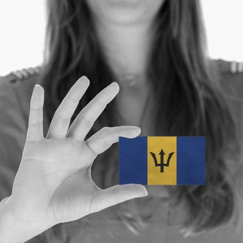 Woman showing a business card, flag of Barbados