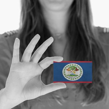 Woman showing a business card, flag of Belize