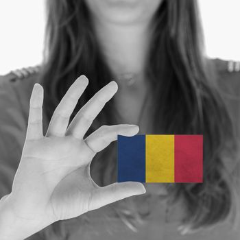 Woman showing a business card, flag of Chad