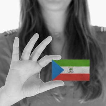 Woman showing a business card, flag of Equatorial Guinea
