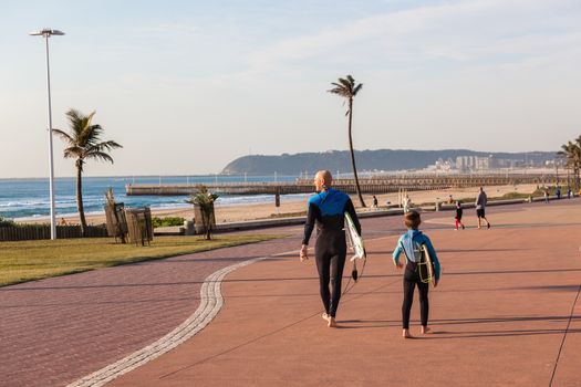 Surfers father and son going surfing at Durban  beach's South-Africa