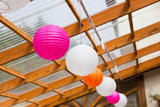 Paper Chinese lanterns are used as decorations or decor for this classy wedding reception.