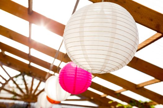 Paper Chinese lanterns are used as decorations or decor for this classy wedding reception.