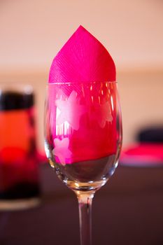 Wine glasses are setup as decor for this wedding reception.