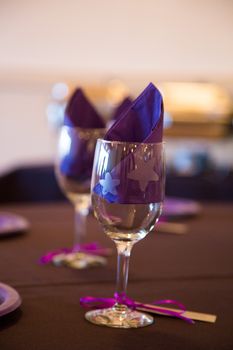 Wine glasses are setup as decor for this wedding reception.