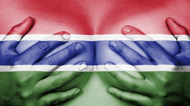 Upper part of female body, hands covering breasts, flag of the Gambia