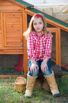 breeder hens kid girl rancher farmer sitting in chicken tractor coop