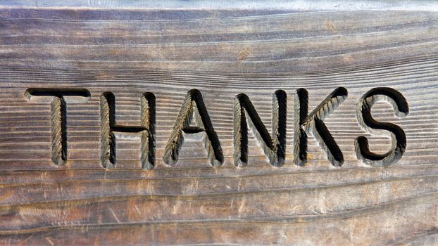 Thanks words in carved in wood