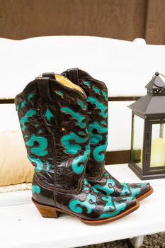 These cowboy or cowgirl boots are ready for the bride to wear them while walking down the aisle at a county wedding in Oregon.