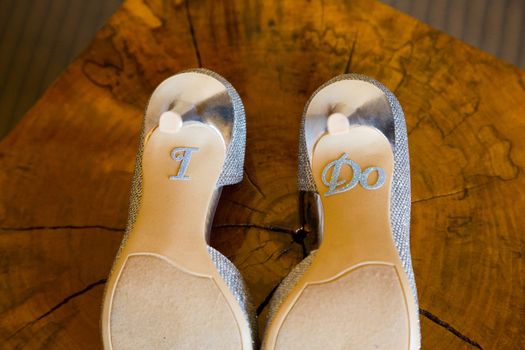 These wedding shoes say I Do on the bottom of the heels.