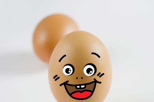 brown egg with smiling face , funny and happy