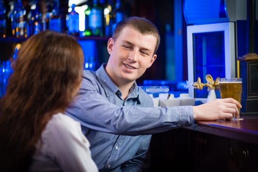 portrait of a young man at the bar, spending time in a nightclub