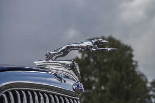 The image is shot at Fredriksten fortress in Halden, Norway during the annual classic car event.