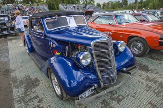 The image is shot at Fredriksten fortress in Halden, Norway during the annual classic car event.