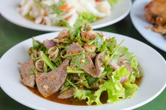 asian cuisine , close up spicy sliced liver salad , mix vegetable and chili