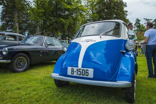 The image is shot at Fredriksten fortress in Halden, Norway during the annual classic car event.