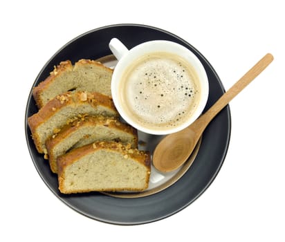 hot coffee in white cup and slices of banana cake on dish  over white background
