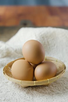 brown eggs in the basket on  sackcloth