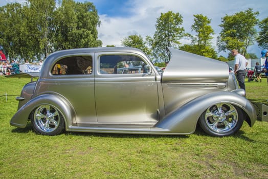 The image is shot at Fredriksten fortress in Halden, Norway during the annual classic car event.