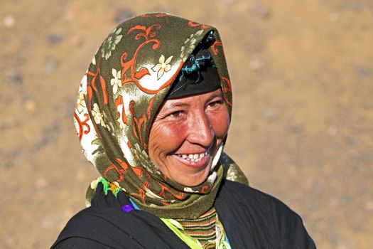 Young nomad woman in the desert