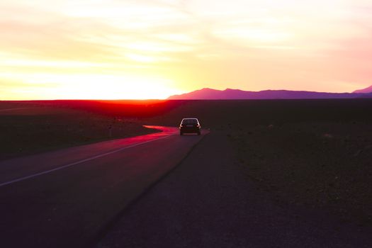 Driving in the desert at sunset in Morocco Africa