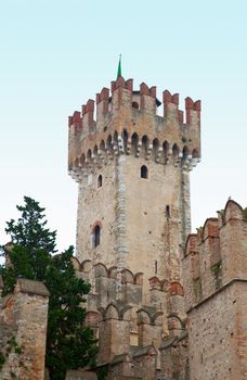 Tower of castle of Sirmione, Italy. Vertical image with lite blue sky