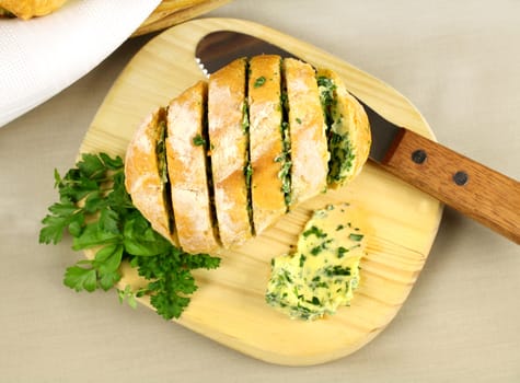 Fresh baked sliced herb and garlic roll from the oven.