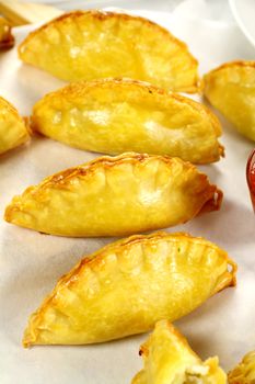 Delicious fresh baked golden cornish pasties ready to serve.