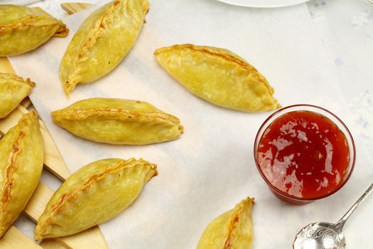 Delicious fresh baked golden pasties with sweet chili relish.