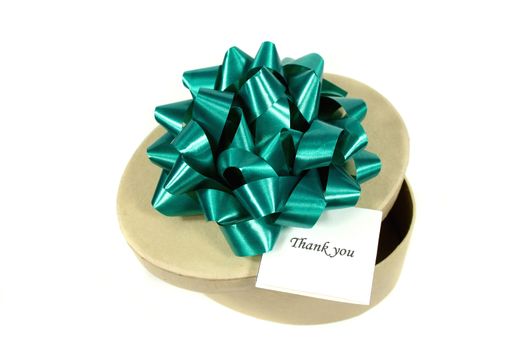 Green bow on a thank you gift.