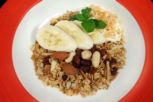 Toasted muesli with fresh banana, coconut and low fat yogurt. 
