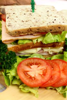 Delicious ham and salad sandwich with ingredients ready to serve.