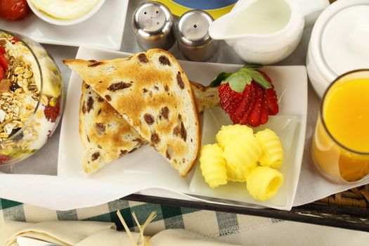 Delicious packed breakfast tray with raisin toast ready to serve.