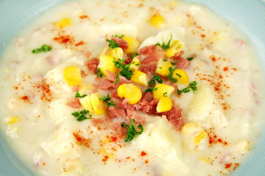 Background of ham corn and potato chowder with paprika ready to serve.