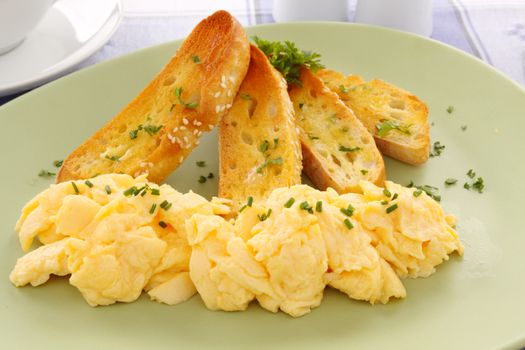 Delicious and healthy breakfast of scrambled eggs with Turkish bread toast.